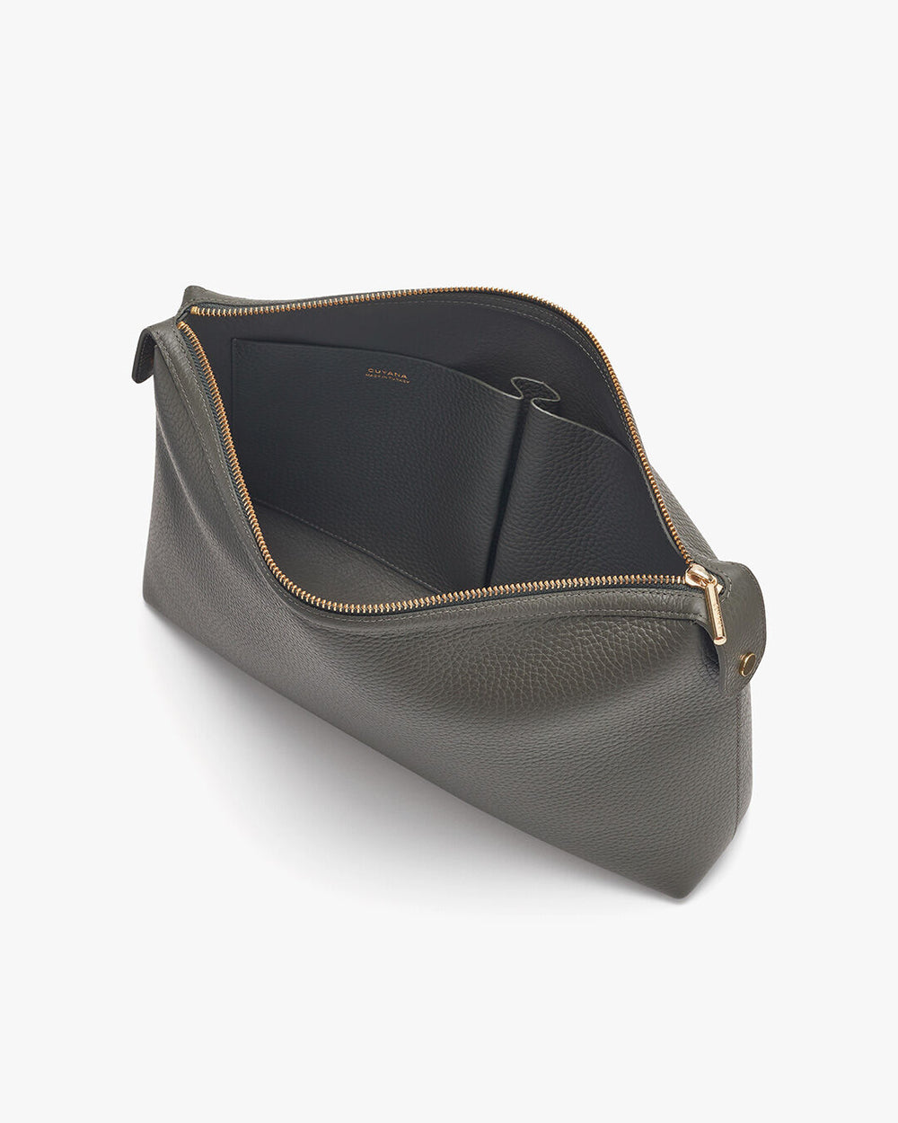 Open cosmetic bag on a plain background.