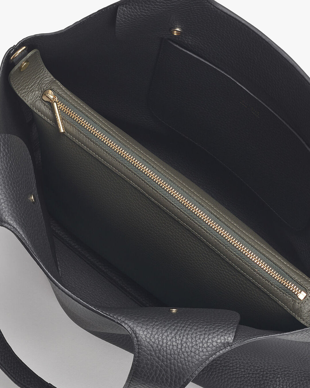 Open handbag with visible interior zipper pocket.