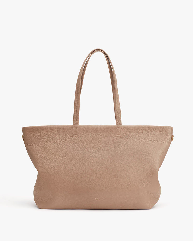 Large tote bag with two handles standing upright.