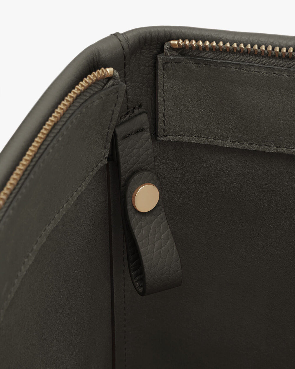 Close-up of a bag with zipper and snap fastener