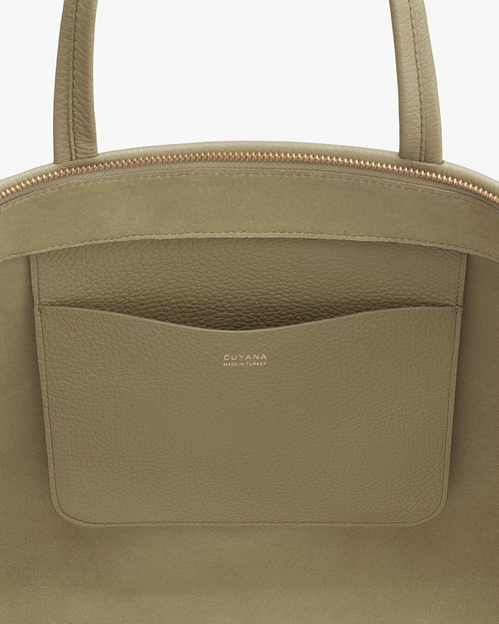 Close-up of a handbag with a front pocket and brand logo.