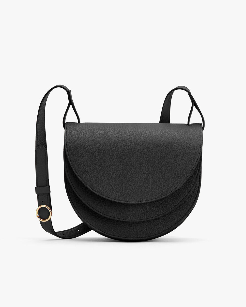 Small saddle-style shoulder bag with a flap closure and an adjustable strap.