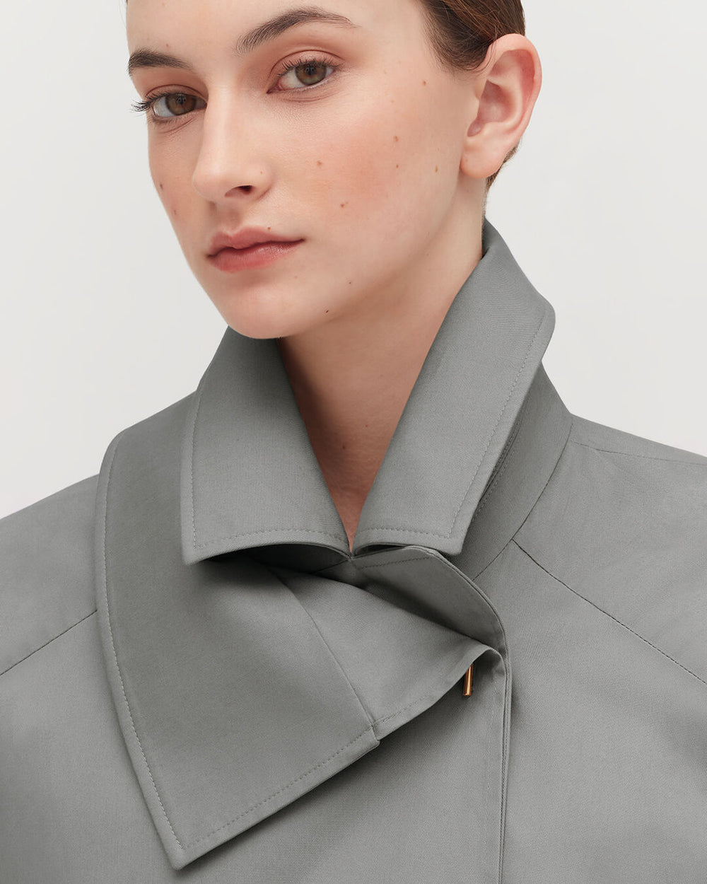 Close-up of a woman wearing a shirt with a large collar.