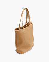 Tote bag with two handles standing upright.