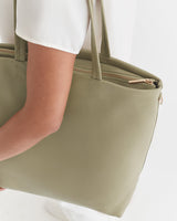 Person holding a large handbag