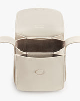 Open leather wallet with multiple compartments and a snap closure.
