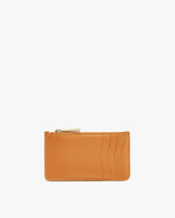 Wallet with textured surface and zipper on white background.