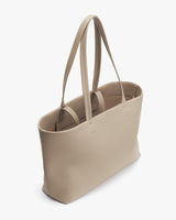 Tote bag with two handles, standing upright.