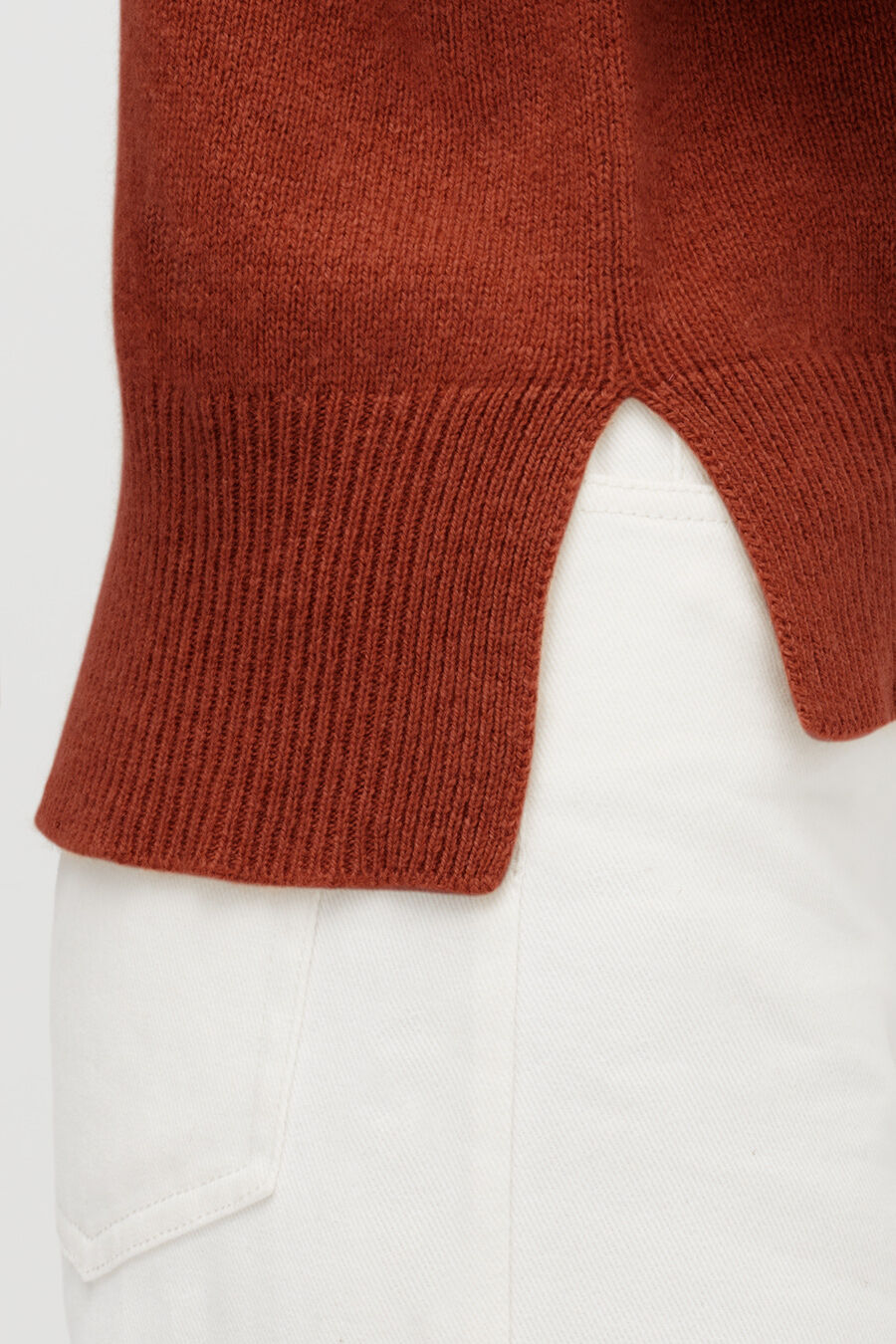 Close-up of a sweater over pants