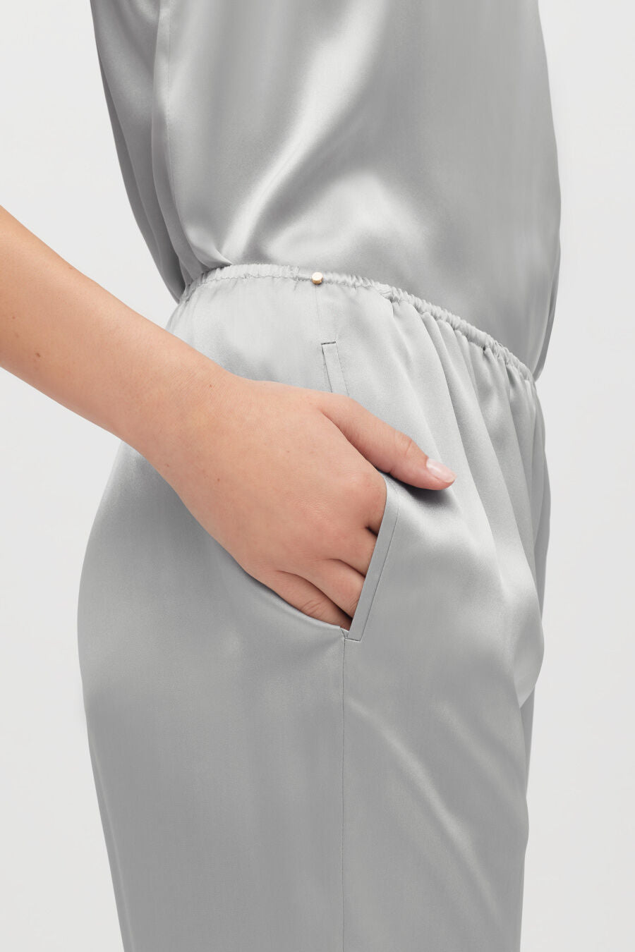 Person with hand in pocket of a dress.