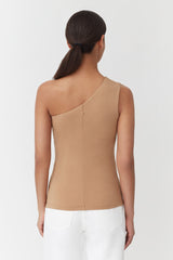 Woman from behind with ponytail, wearing a sleeveless top and pants.