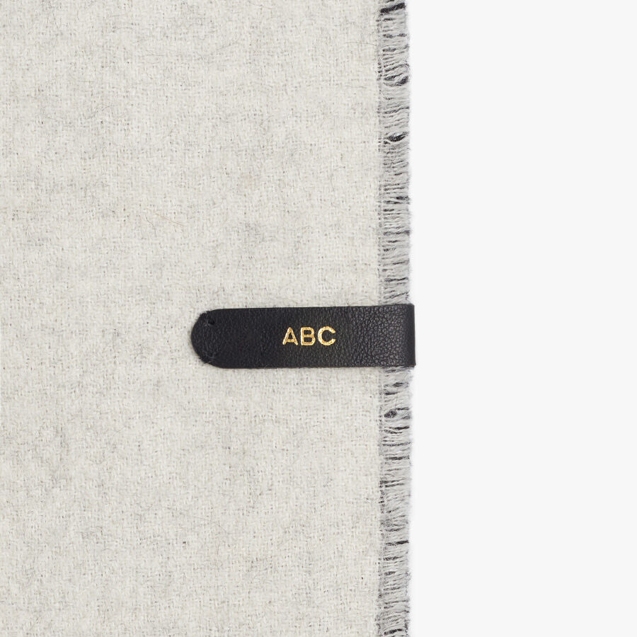 Fabric with a tag labeled ABC attached to the side.