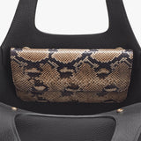 Close-up view of a handbag with a textured flap.