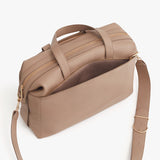 Travel bag with a shoulder strap and dual handles.