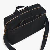 Travel bag with multiple zippers and a shoulder strap.
