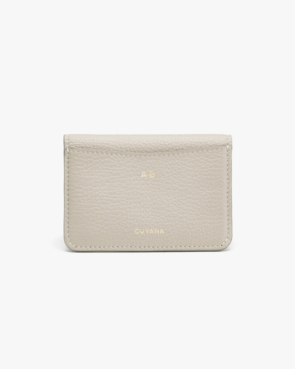 A leather wallet with embossed brand name on white background.