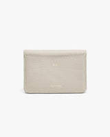 A leather wallet with embossed brand name on white background.
