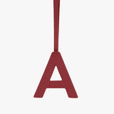 Letter A hanging from a strap