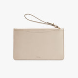 Wristlet clutch with a zipper and attached strap.