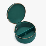 Round jewelry box with open lid and divider inside.