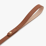 Leather strap with a snap fastener.