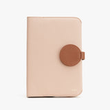 Wallet with a circular clasp on a plain background.