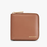 Zippered wallet with monogram on front.