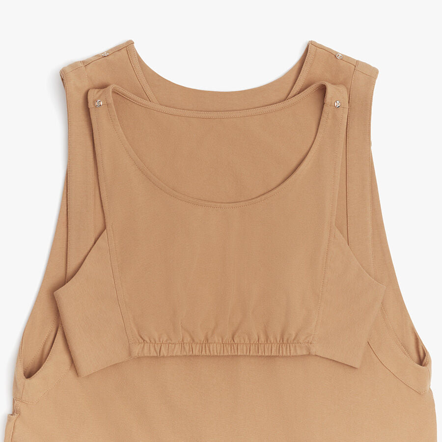 Top with shoulder snaps and a gathered waist detail.