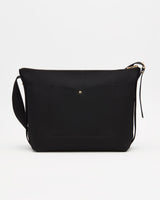 Small shoulder bag with front pocket and zipper closure.