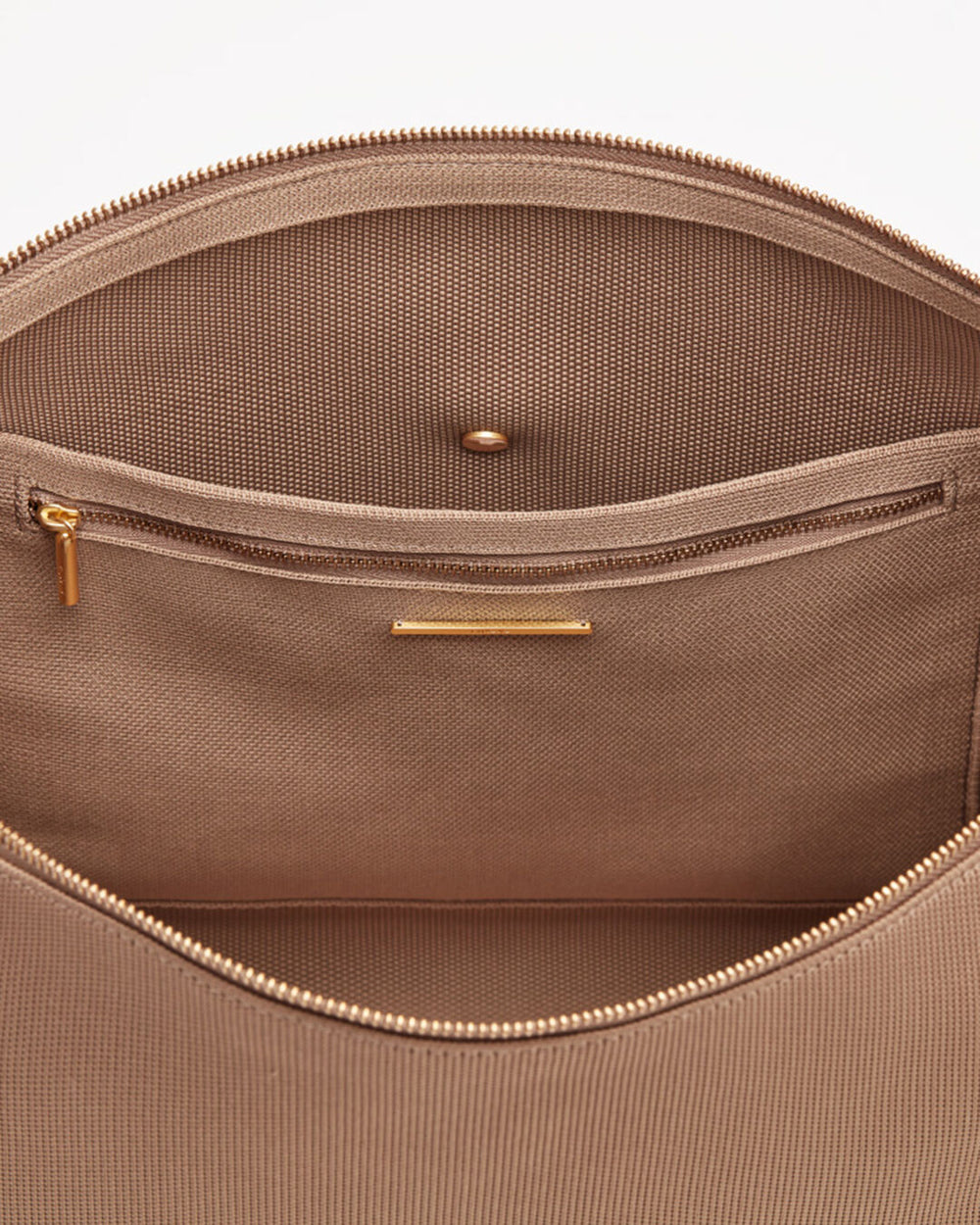 Open bag showing interior compartments and zippers.