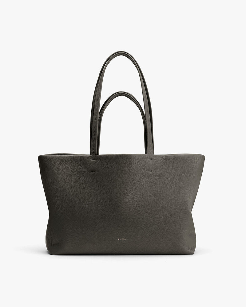 Large tote bag with two handles standing upright.