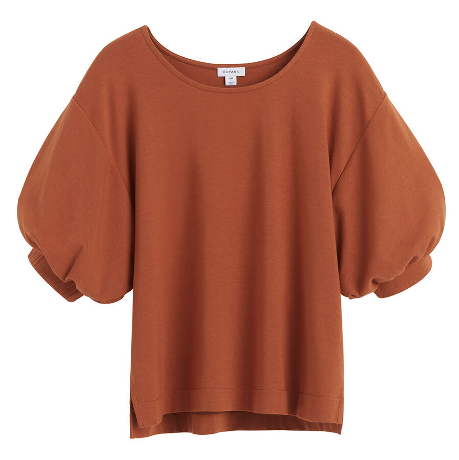 Sweatshirt with puffed sleeves on plain background.