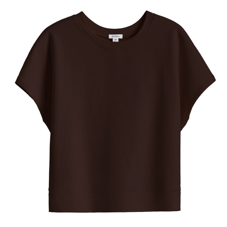 Short-sleeved cropped t-shirt on a plain background.