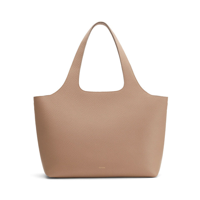 Large tote bag with textured surface and single handle.