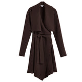 Women's wrap-style coat with a belt and asymmetrical hem.