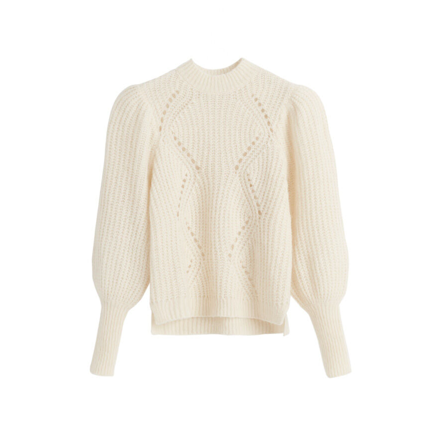 Cable knit sweater with long sleeves and a crew neck.