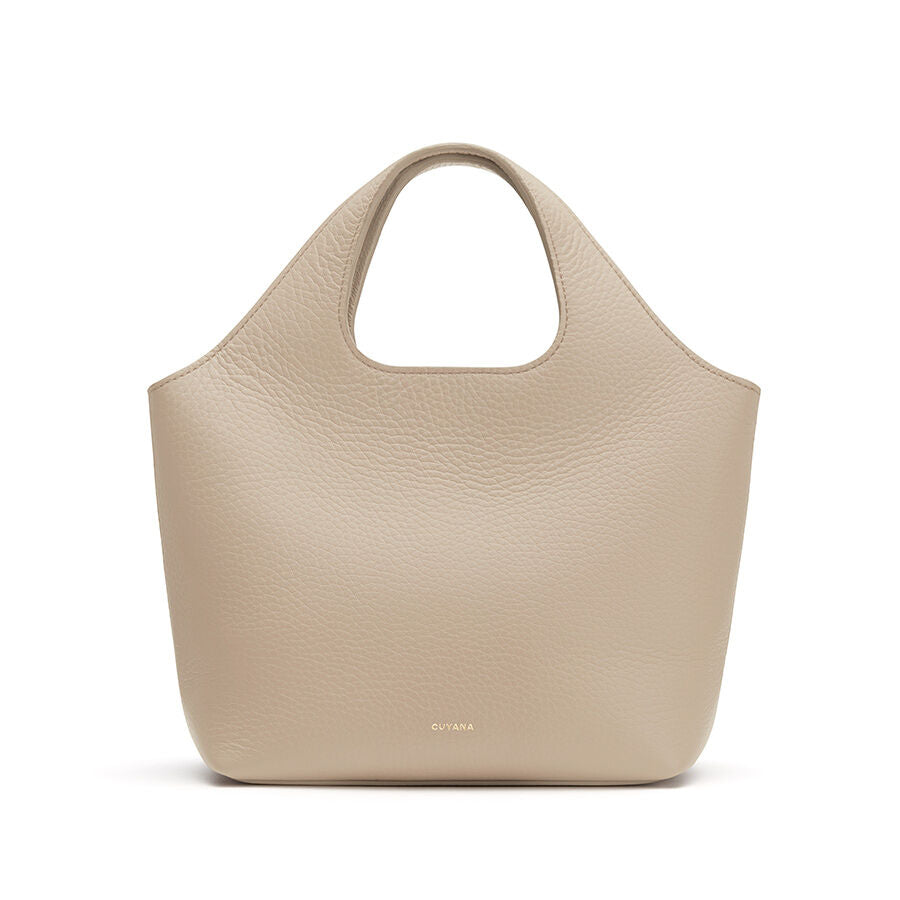 Plain handbag with a single handle, isolated on a white background.