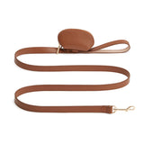 Leather leash with detachable small pouch and metal clasp.
