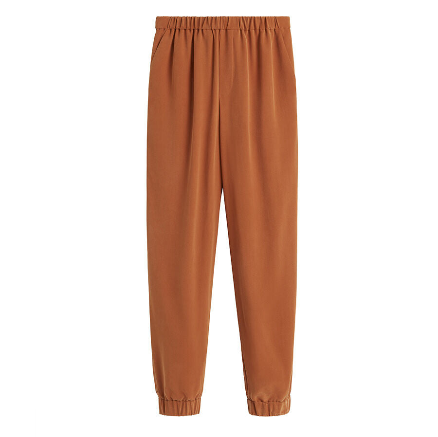 Elastic waistband pants with gathered cuffs.