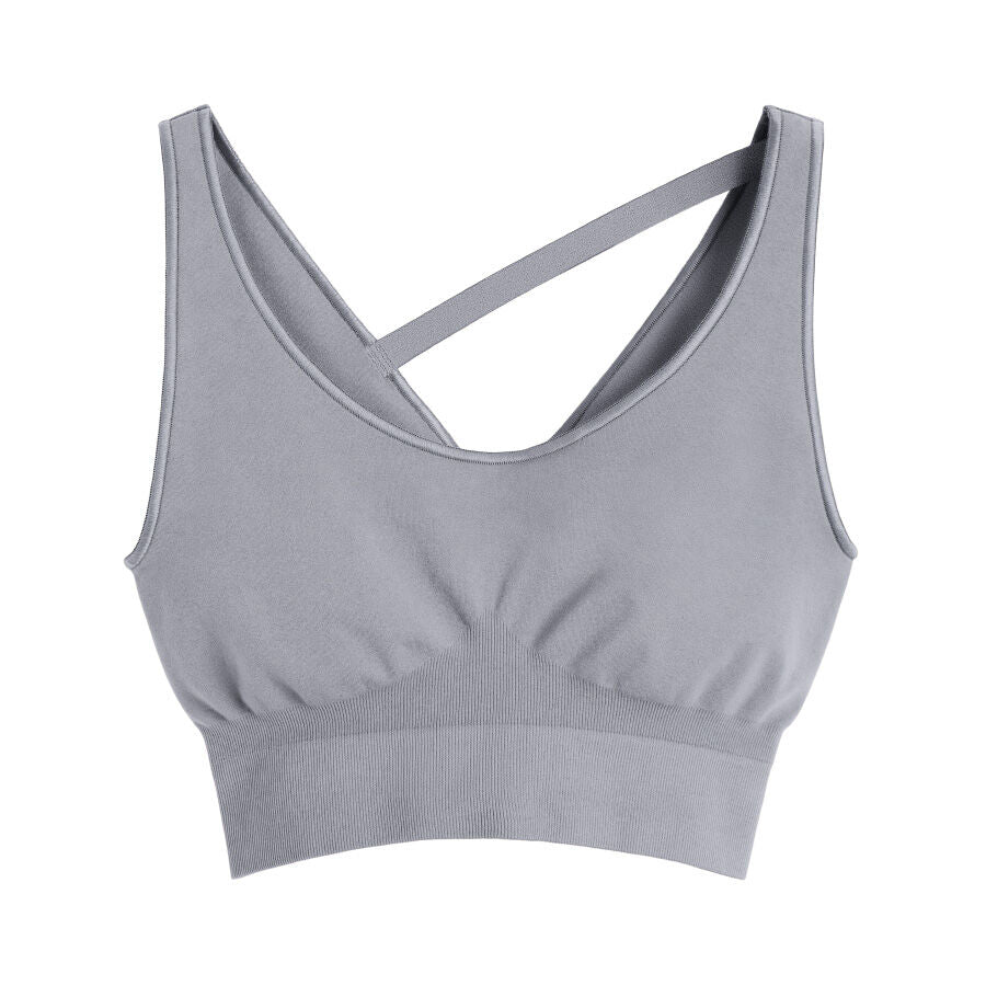 Sports bra with a crossed strap design isolated on a white background.