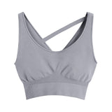 Sports bra with a crossed strap design isolated on a white background.