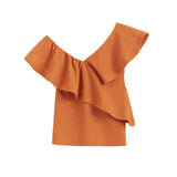 One-shoulder ruffled top on a plain background.
