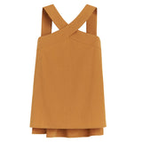 Sleeveless top with crisscross back straps and layered hem.