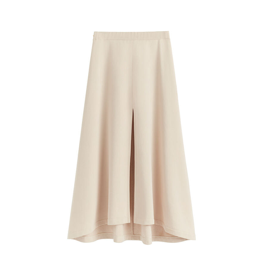 Long skirt with a high waist and front slit.