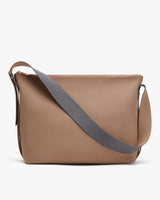 Handbag with adjustable strap and smooth texture.