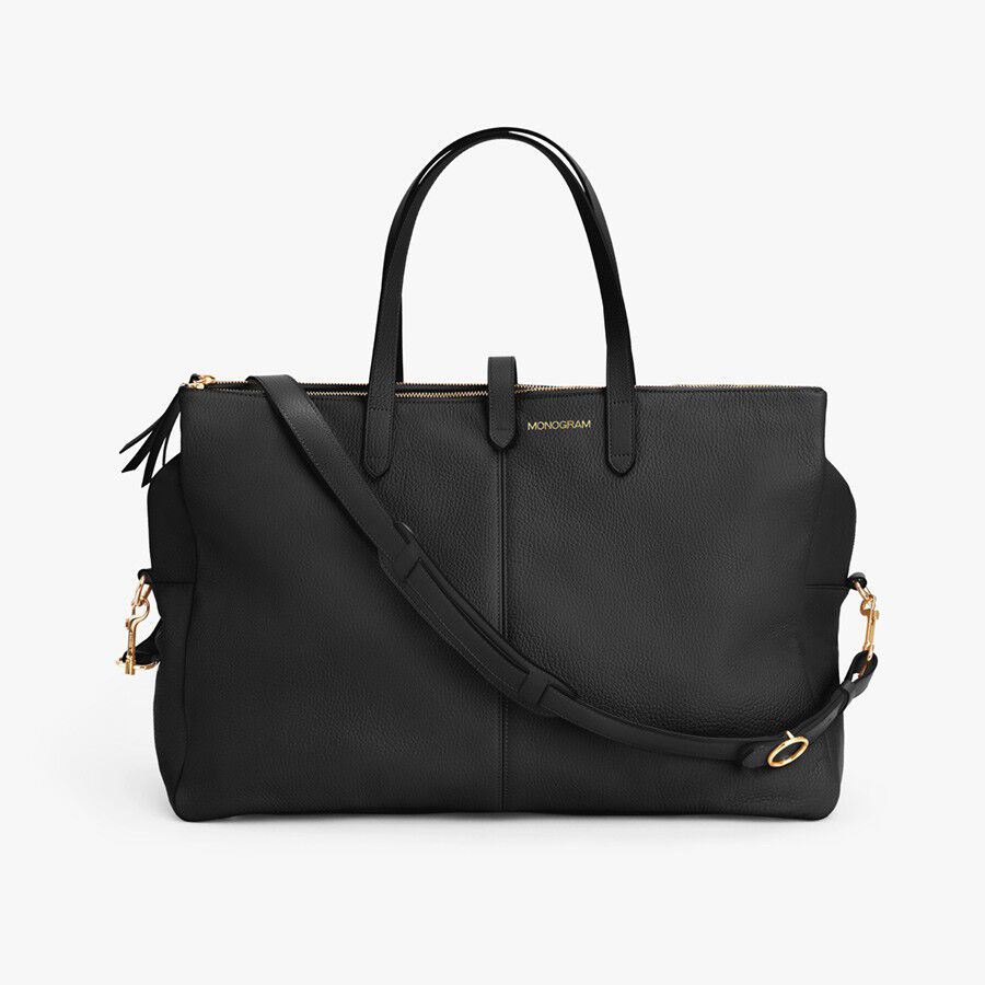 Large handbag with two handles and a shoulder strap.