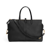 Handbag with two handles and a shoulder strap, isolated on a plain background.
