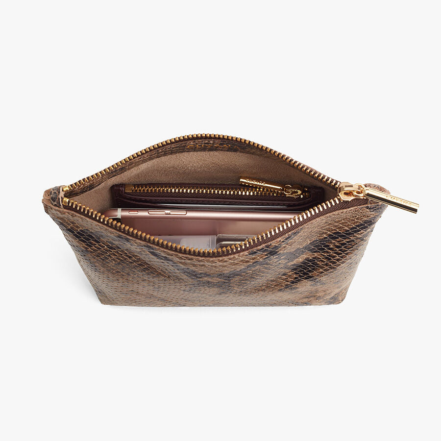 Open cosmetic bag with a lipstick inside