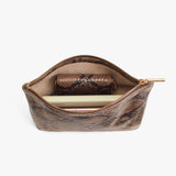 Open handbag with a wallet and a notebook inside.