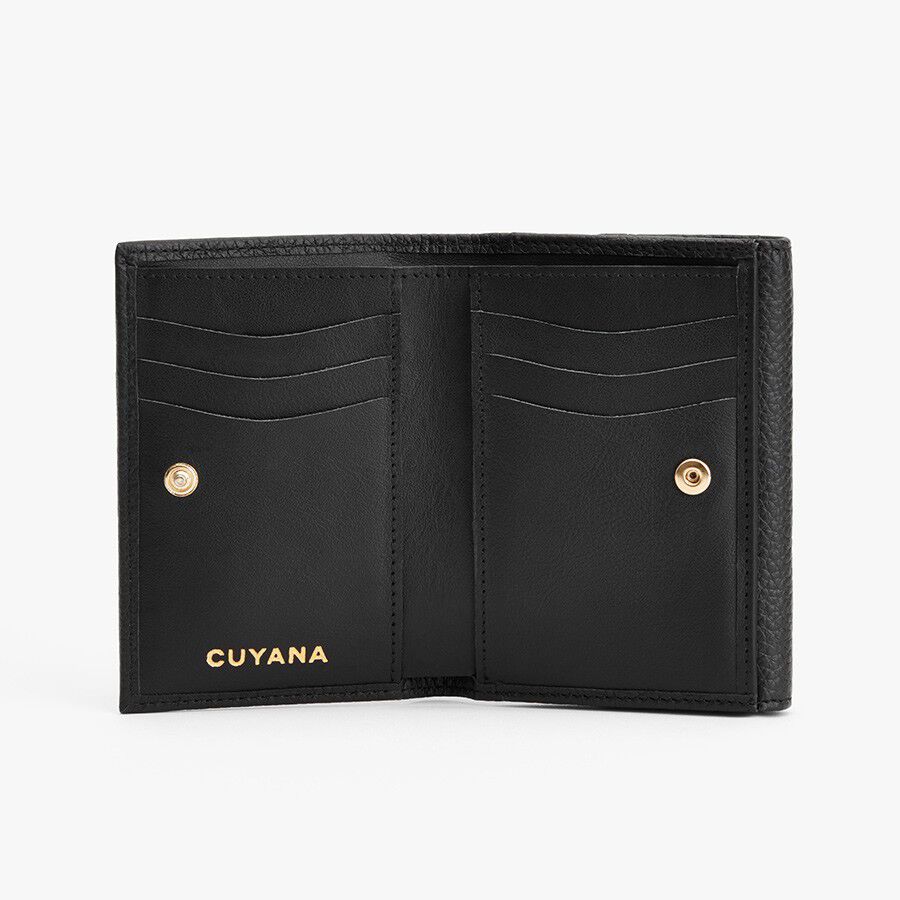 Open wallet with multiple card slots and snap closures.